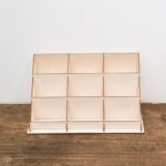 a wooden shelf with compartments
